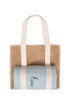Mesh beach bag with cream straps holding a rolled light blue towel with a green toucan embroidery.