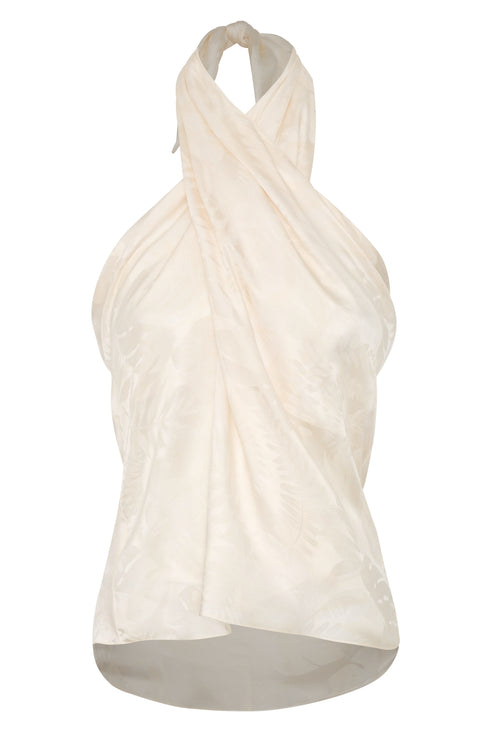 Ivory silk jacquard halter blouse with a draped, wrap-style front and rainforest pattern.
